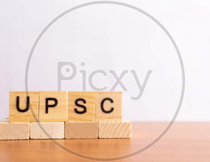 Upsc Or Union Public Service Commission In Wooden Block Letters On Isolated Background