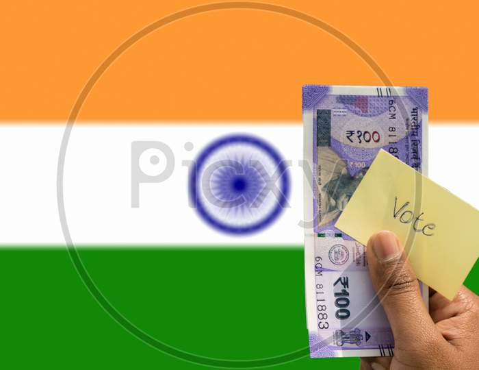 Hand Holding Money And Vote A Concept Of Political Corruption The Purchase Of Votes In Elections Background As A Indian Flag