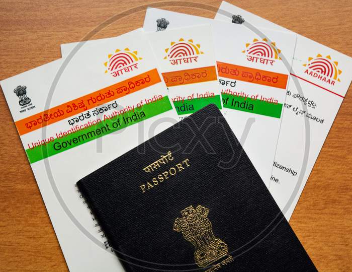 Aadhaar Card And Passport Which Is Issued By Government Of India As An Identity Card To Travel Foreign.