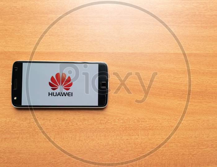 Huawei Logo On Screen Of Mobile. Huawei Technologies Co., Ltd. Is A Chinese Multinational Networking And Telecommunications Equipment And Services Company