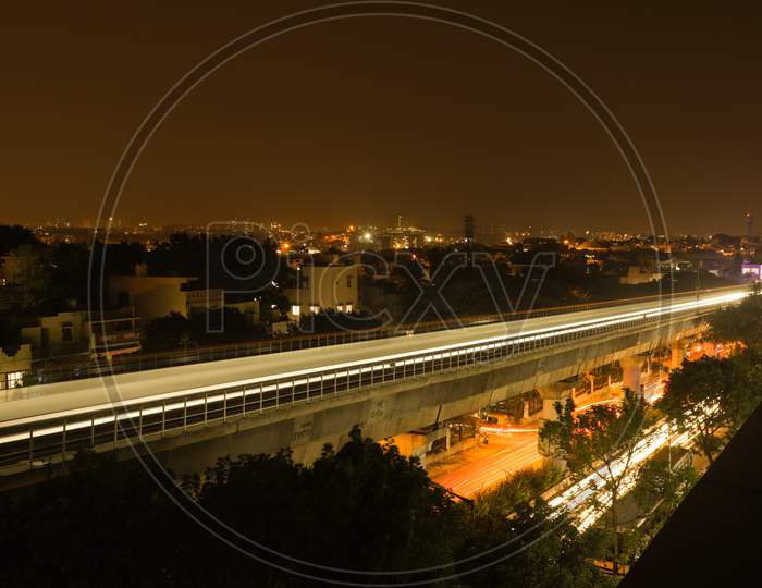 Long Exposure Shot Of Bengaluru Metro Train Moving On The Bridge New Mysore Road Bengaluru, India.