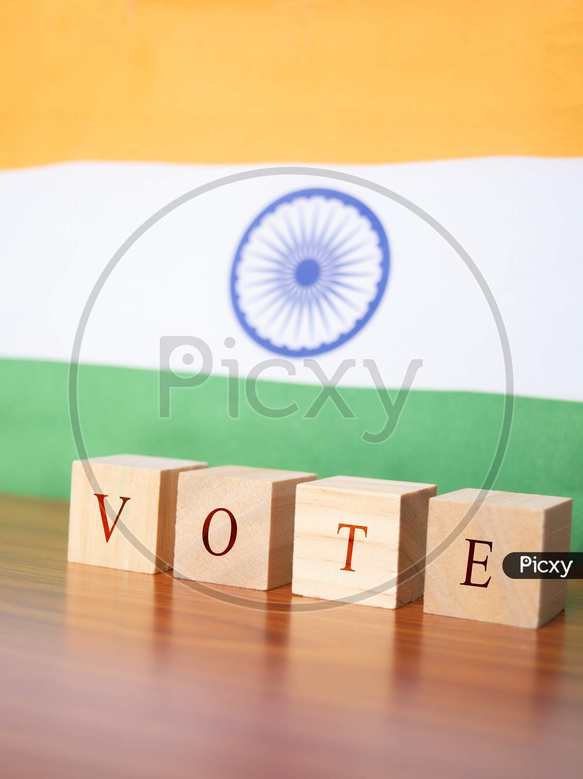Concept Of Indian Election, Vote In Wooden Letters On Table, Indian Flalg As A Background.