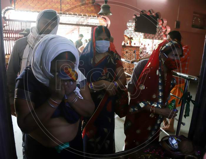 Hindu Devotees Offer Prayers After Reopening of a Temple In Prayagraj, June 8, 2020.