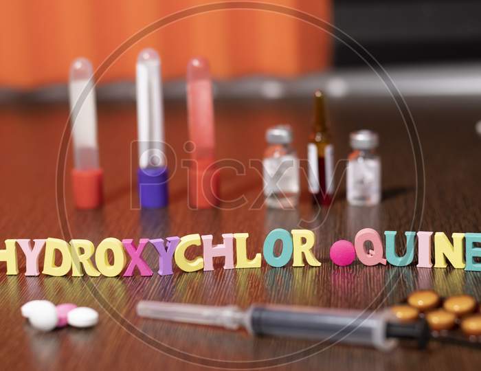 hydroxychloroquine written with Plastic letters
