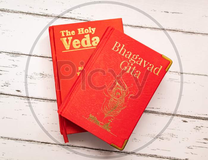 Holy Bhagavad Gita And The Holy Veda The Oldest Scriptures Of Hinduism On Wooden Textured Background