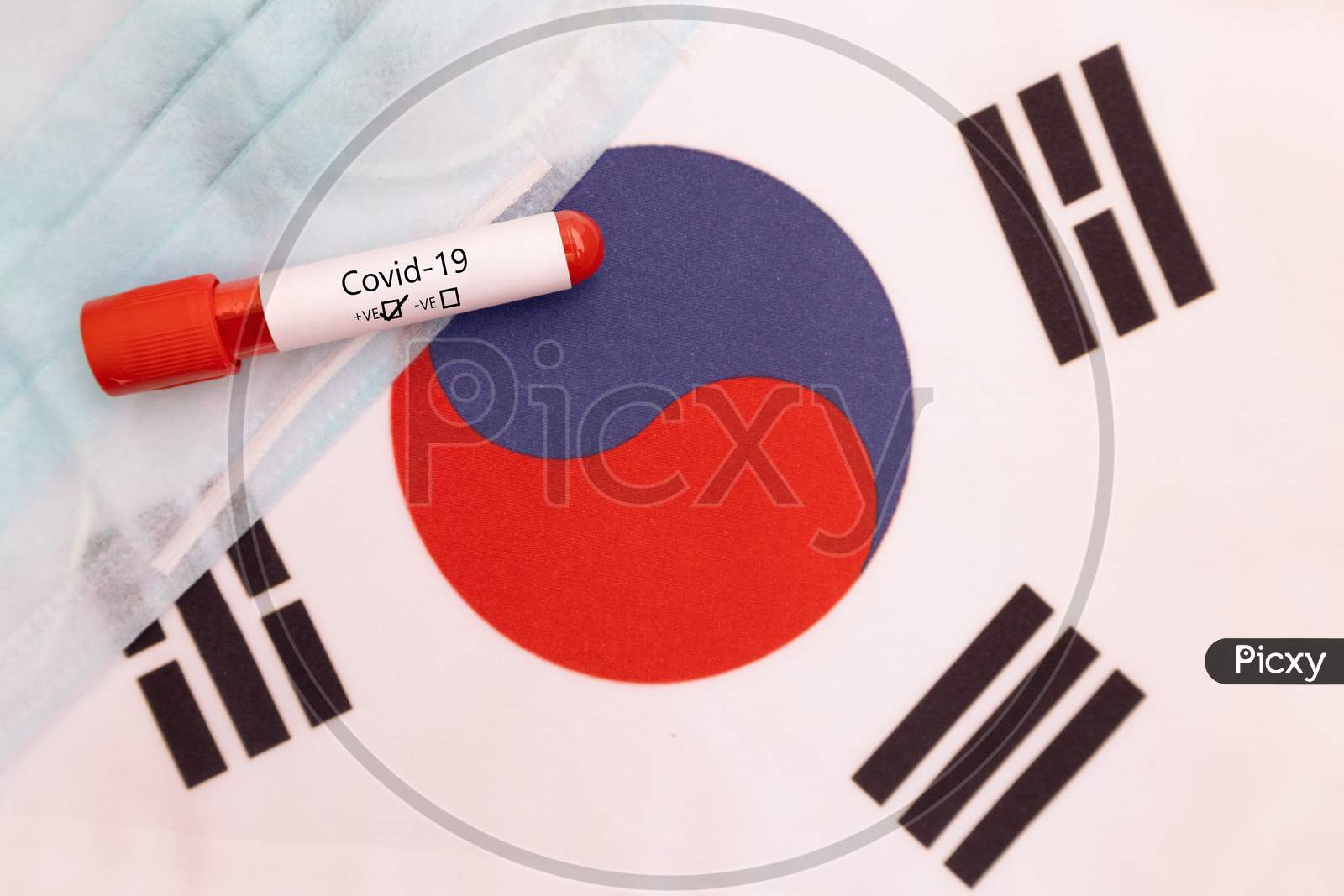 Concept Of Novel Coronavirus Spread From China To South Korea - 2019-Ncov Or Covid-19 Disease Positive Test On South Korean Flag Showing With Blood Sample.