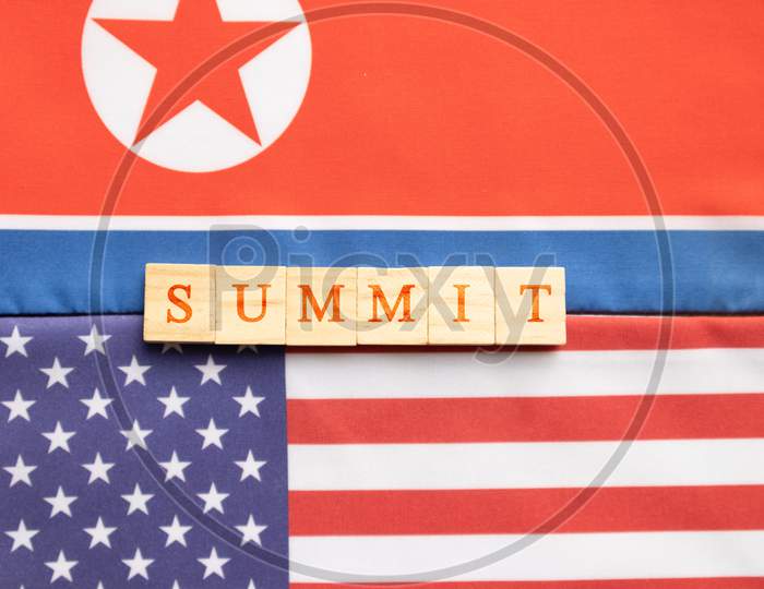 Concept Of Bilateral Relations Of Usa And North Korea Showing With Flag And Summit In Wooden Block Letters