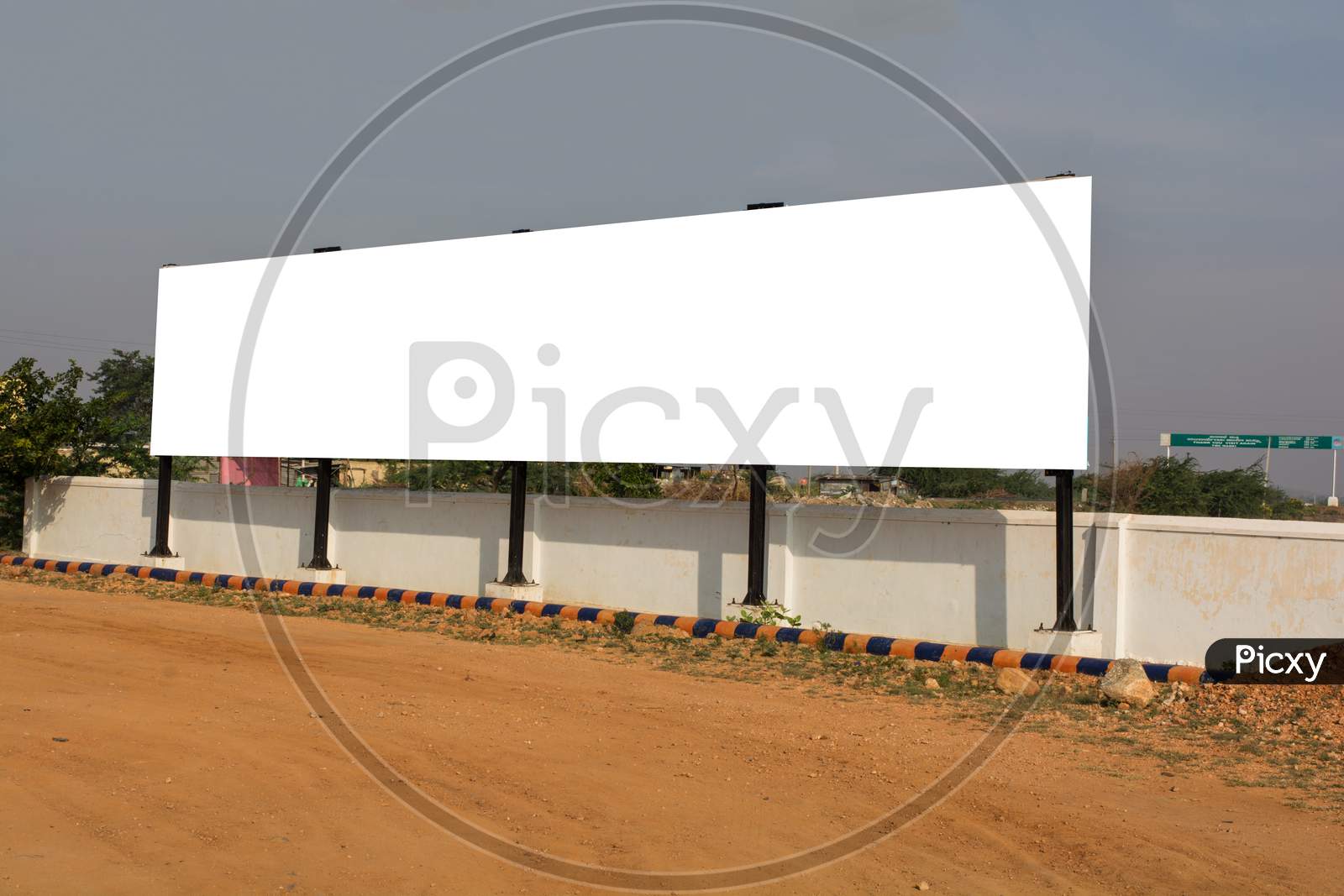 Big Blank Billboard With White Background Space For Advertisement In Urban India.