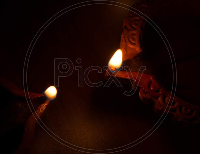 Closeup Of Diwali Terracotta Diyas On Dark Background Which Are Used Lighting Up The House During Diwali Times.