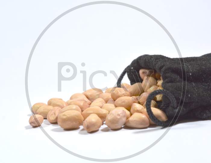 Peanuts In Burlap Bag Isolated On White Background