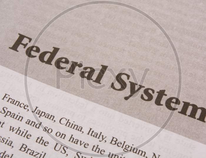Concept Of Federal System Printed On Paper.