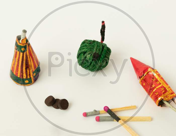 Close Up Of Different Types Of Diwali Firecrackers On Isolated Background With Copy Space.
