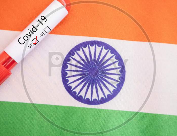 Concept Of Covid-19, Coronavirus Or Ncov 2019 Positive Test At India Showing With Blood Sample And Flag.