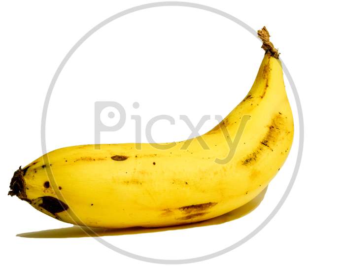 Single Banana With Dark Spots On It Isolated