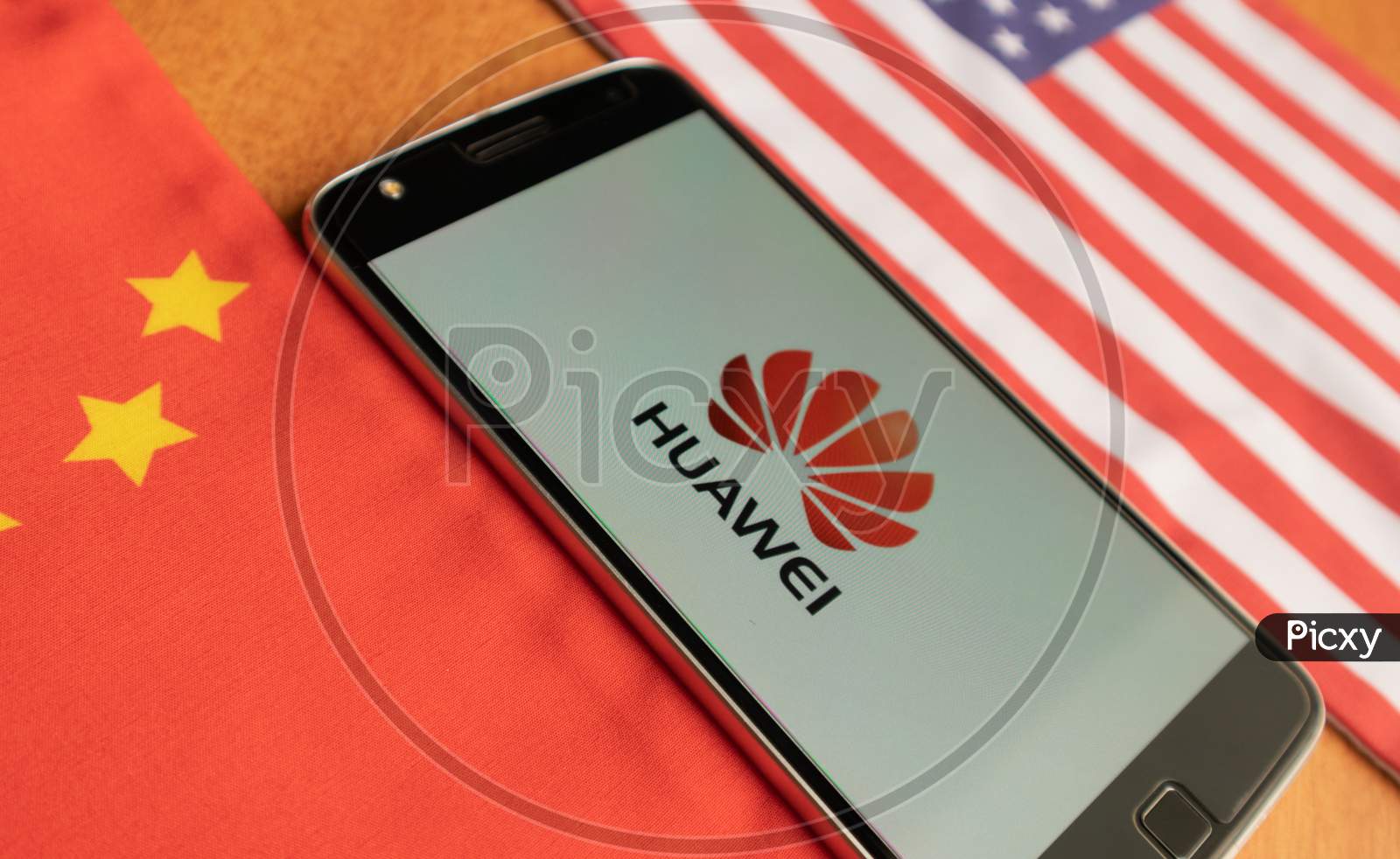 Bangalore, India, June 4, 2019 : Huawei Logo In Mobile, Kept In Between The Us And China Flag.