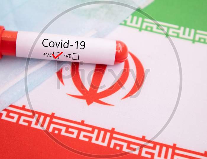 Mask Prevention Of Respiratory Disease Caused By Covid-19, Coronavirus Or Ncov 2019 Protective Mask With Positive Blood Sample On Iran Flag