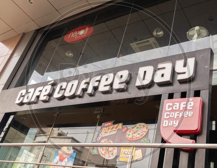Bengaluru, India June 27,2019 : Front View Bill Board Of Cafe Coffee Day Shop Building At Bengaluru.