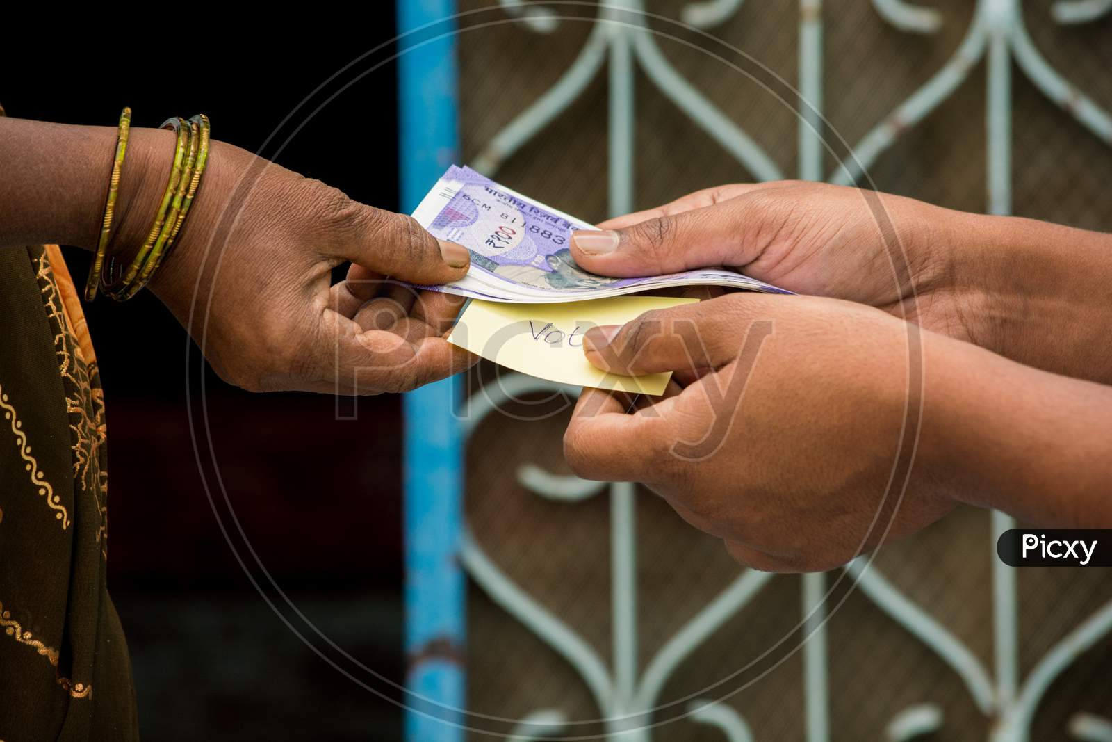 Person Giving Money To Woman For Vote In Front Of The Door, Concept Of Showing A Cash For Vote.
