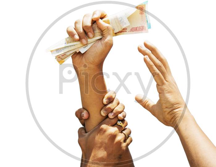 Concept Showing Of Greed For Money, Hands Trying To Grab Money From Another Person Hands