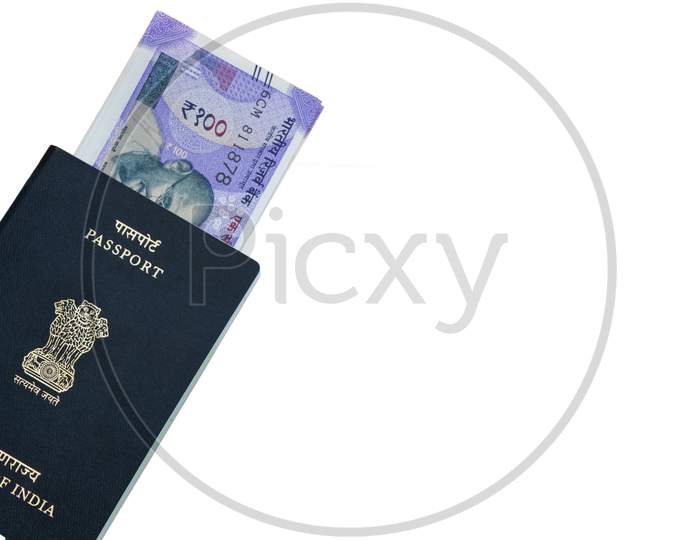 Closeup Of Indian Passport With Indian Currency On Isolated Background.