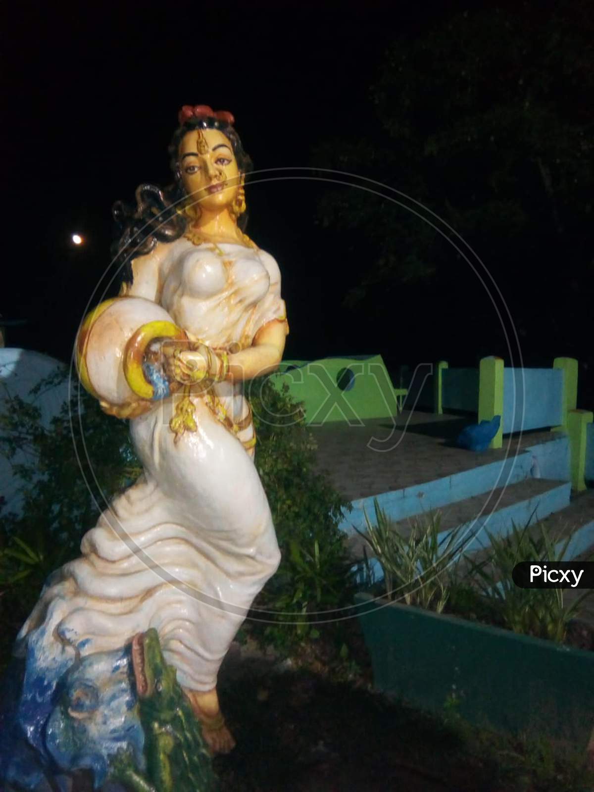 Goddess Ganga statue at night