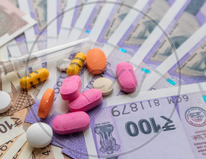 Healthcare In India - Concept Of Health And Business Showing Indian Paper Currency Notes, Pills, Syringe
