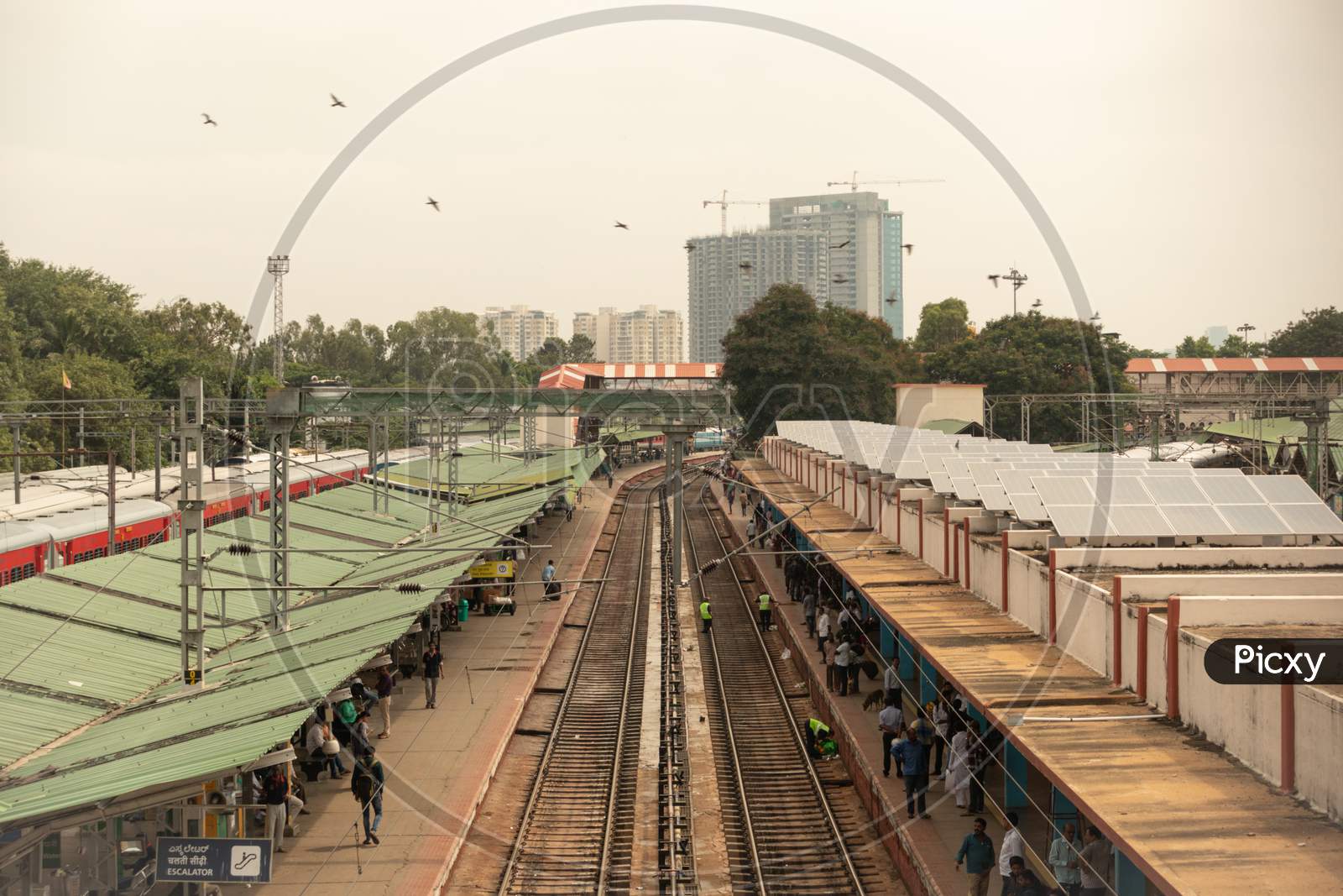 Bangalore India June 3, 2019 : Aerial View Of Passengers Waiting For Train And Workers Cleaning The Railway Track At Railway Station Bengaluru