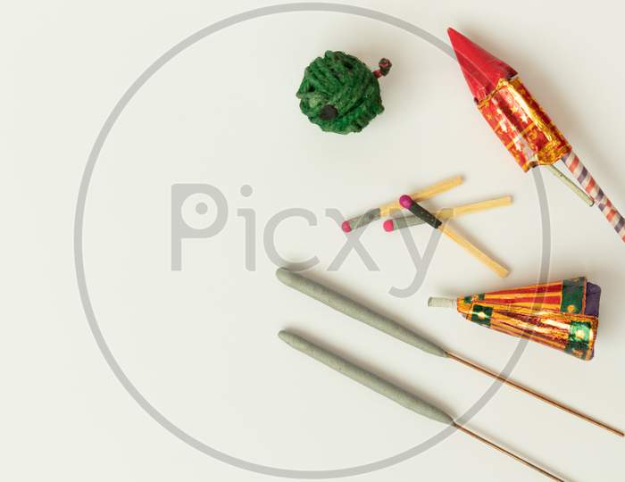 Different Types Of Diwali Firecrackers On Isolated Background With Copy Space.