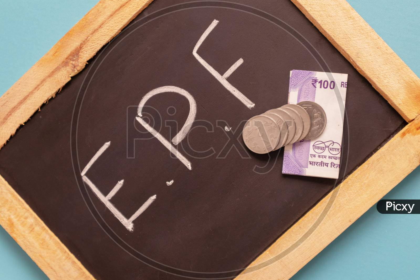 Epf Or Employee Provident Fund Written On Black Slate With Indian Currency Notes And Coin