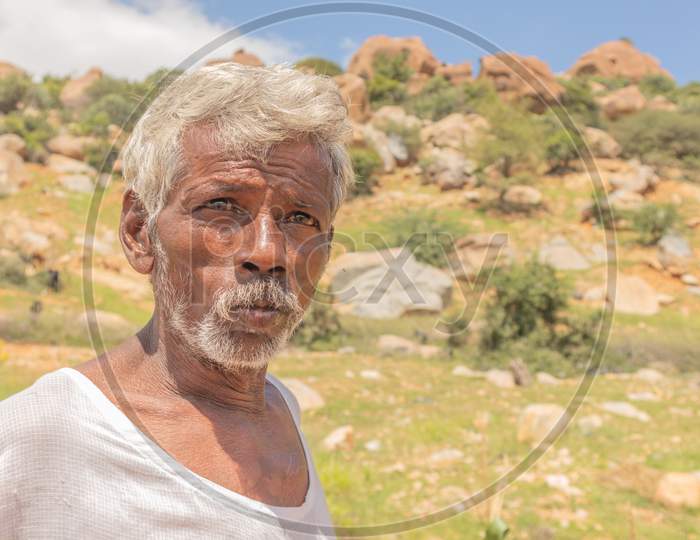 Portrait Of A Tribal Senior Indian Man Staring At The Camera