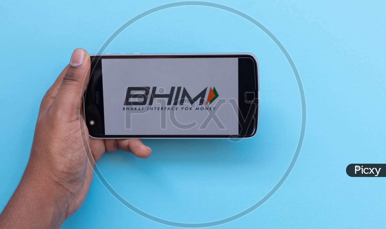 Hands Using Bhim Or Bharat Interface For Money App Is A Digital Wallet By Indian Government Loading On Mobile Phone