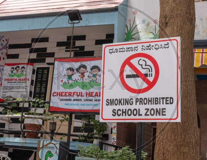 Bengaluru, India June 27,2019 : Smoking Prohibited School Zone Bill Board Infront Of The School Building.