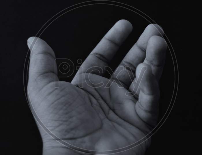 Hand black background