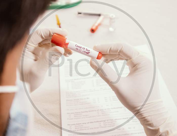 Doctor Holding Test Tube With Positive Coronavirus Or Covid-19 Test Blood Sample - Concept Of 2019-Ncov Pandemic, Novel Chinese Coronavirus, Wuhan Coronavirus Blood Analysis