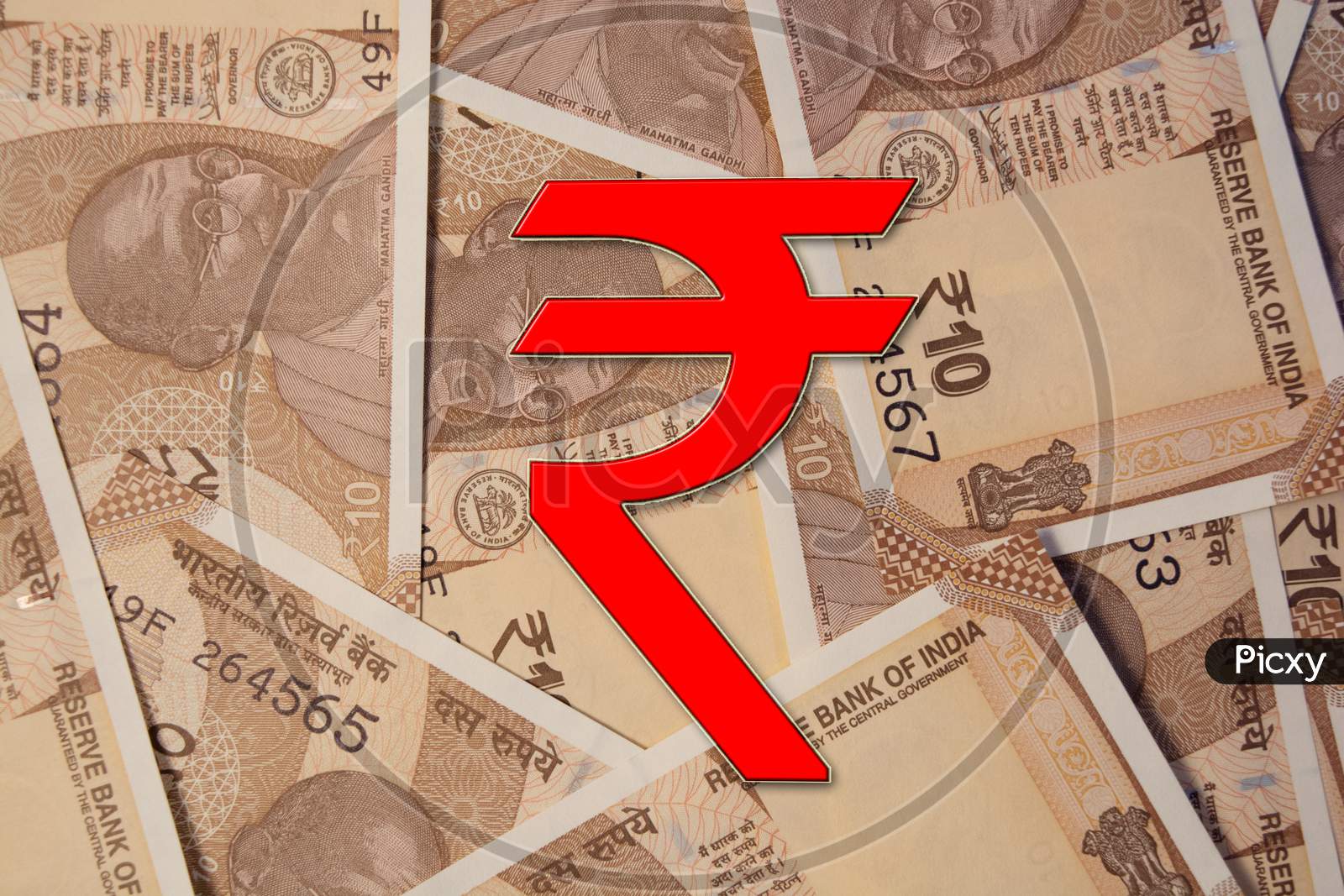 Scattered Indian 10 Rupee Currency Notes With Rupee Symbol.
