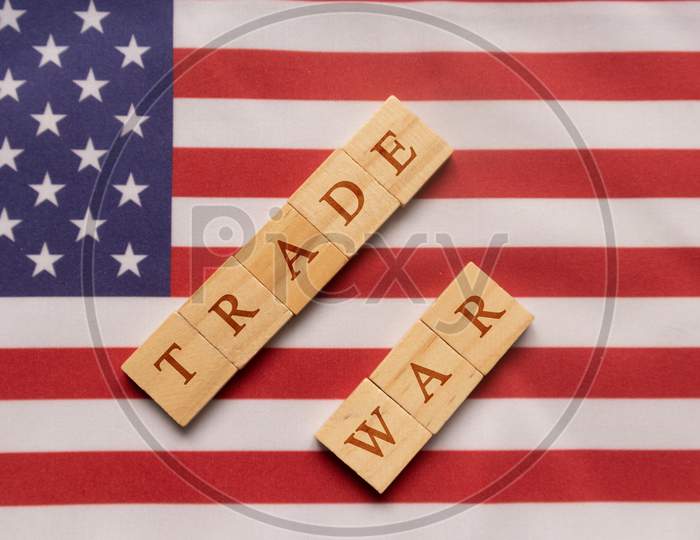 China-Us Trade War Concept - Flag Of China And The United States With Wooden Block Letters