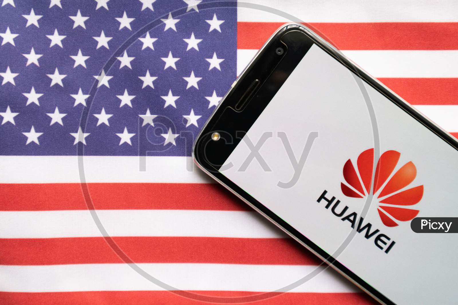 Huawei Logo On Screen Of Mobile On Us Flag