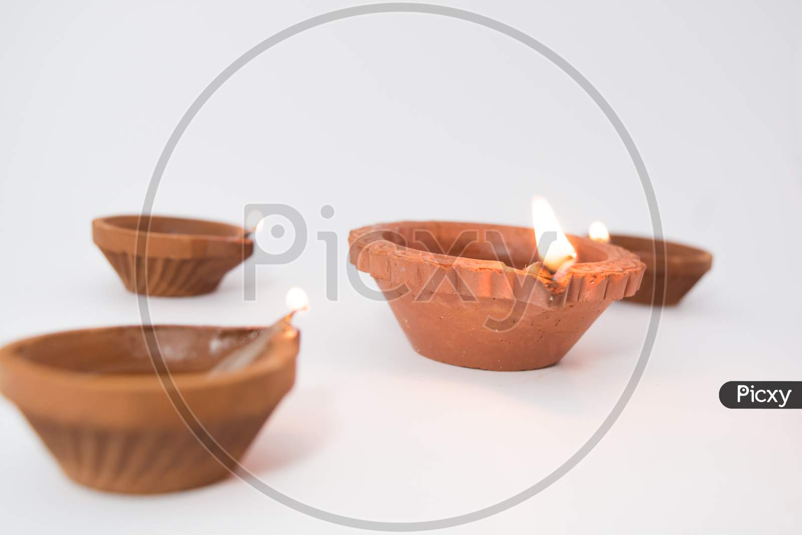 Closeup Of Diwali Terracotta Diyas On isolated  Background Which Are Used Lighting Up The House During Diwali Times