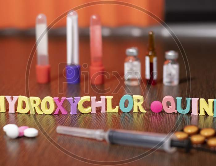 hydroxychloroquine written with Plastic letters