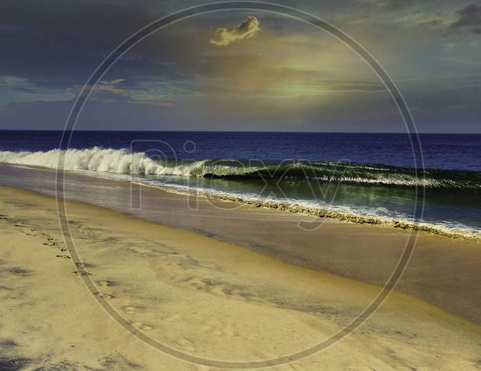 A Sandy Beach With A Footprint