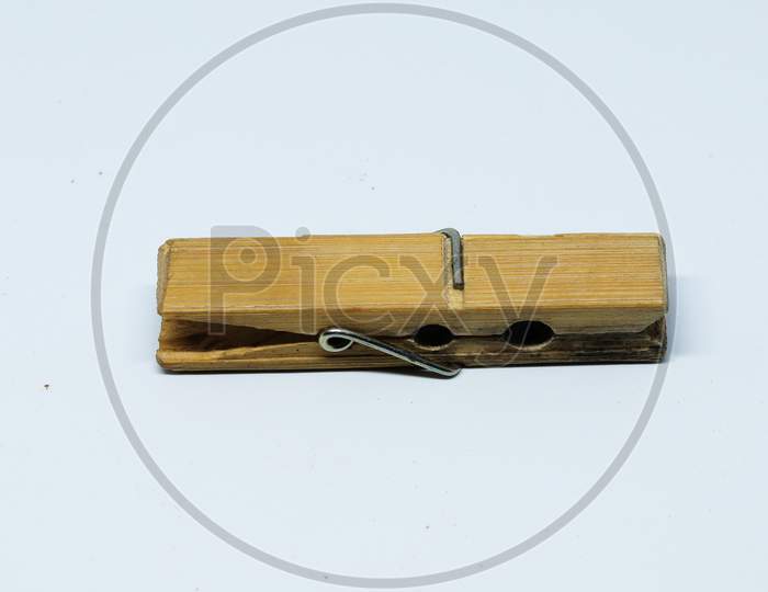 wooden clothes pin on a white background