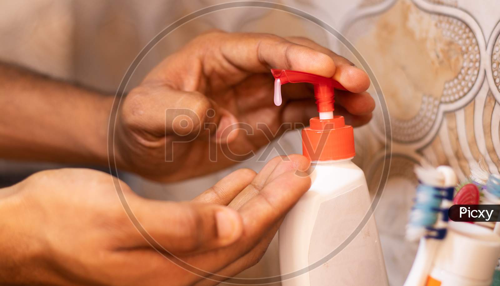 A person using Hand Sanitizer as a safety precaution to protect from Corona Virus or COVID 19