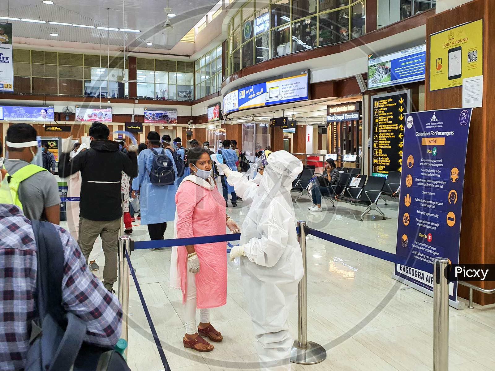 6Th June 2020- Bagdogra Airport,Siliguri, West Bengal, India-Passengers In Protective Gear Being Thermal Scanned For Covid Screening By Airport Crew At Bagdogra Airport