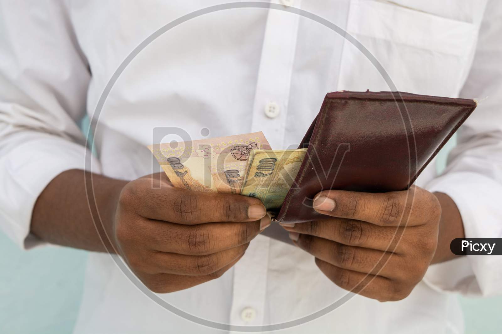 Closeup Of Man Hands Taking Indian Currency Out Of His Wallet