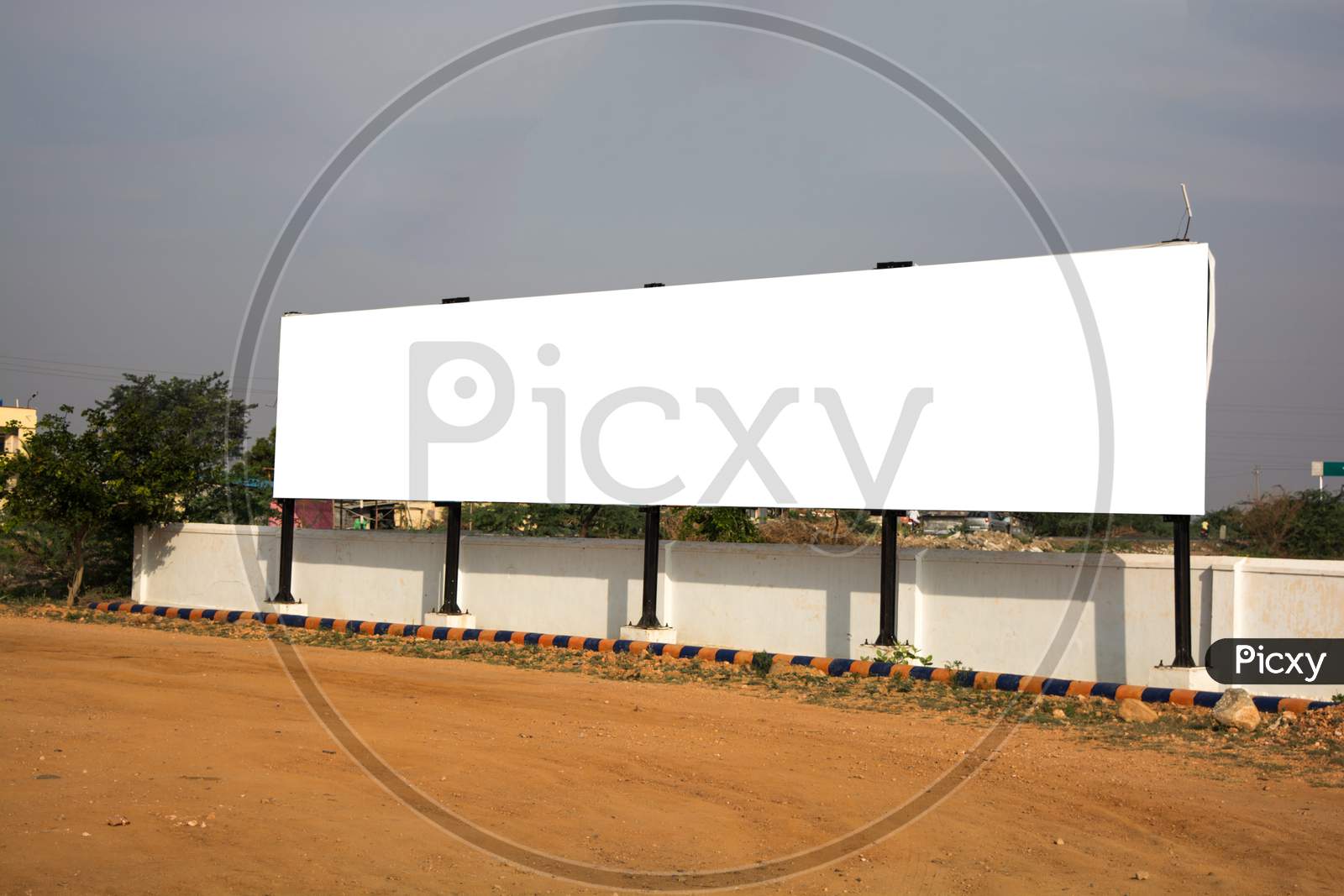 Big Blank Billboard With White Background Space For Advertisement In Urban India.