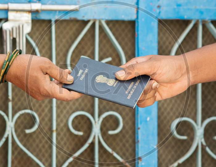 Concept Of Woemn Receving Passport At The Door Step Of The House In India
