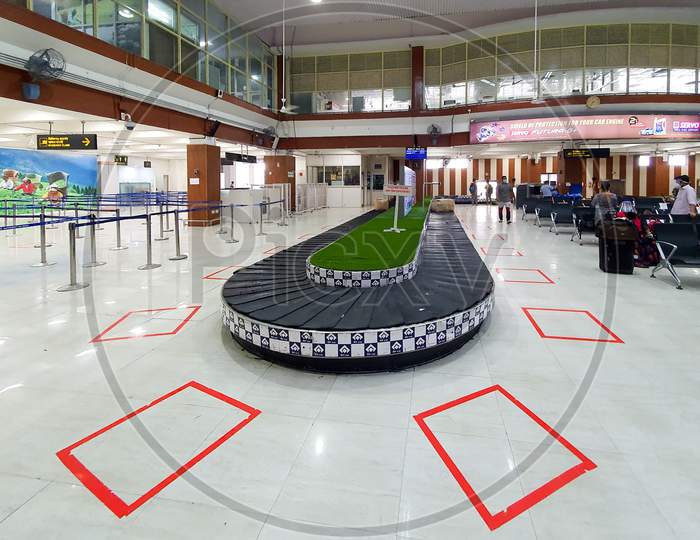 6Th June 2020- Bagdogra Airport,Siliguri, West Bengal,India - The Baggage Counter Of Bagdogra Airport Showing Red Demarcated Zones To Stand To Maintain Social Distancing For Covid 19