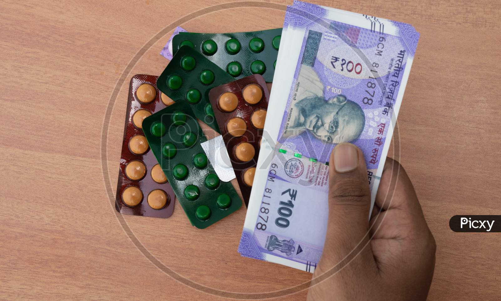 Concept Of The Person'S Hands Buying Pills Or Tablets With Indian Currency