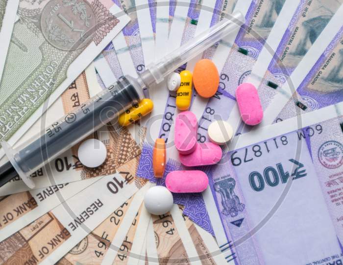 Healthcare In India - Concept Of Health And Business Showing Indian Paper Currency Notes, Pills, Syringe