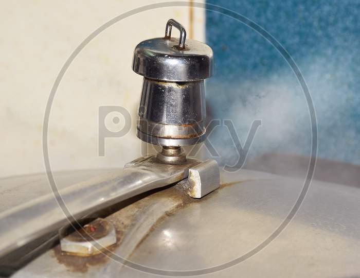 Hot steam release from a pressure cooker